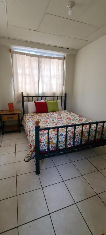 Ένα ή περισσότερα κρεβάτια σε δωμάτιο στο Casa Elizabeth Apartamentos