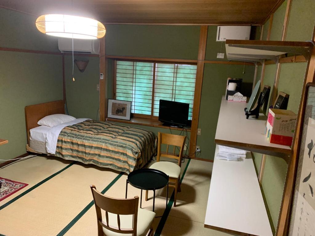 Postel nebo postele na pokoji v ubytování オーベルジュ美の浜 流石