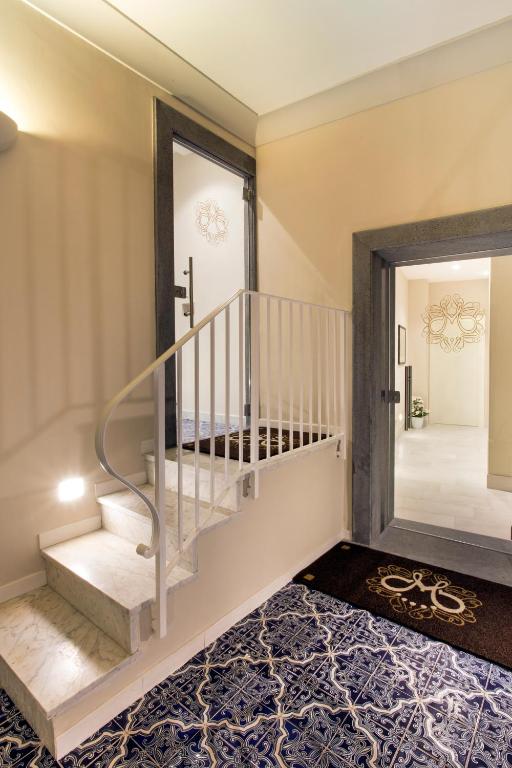 A bed or beds in a room at Magi House Relais