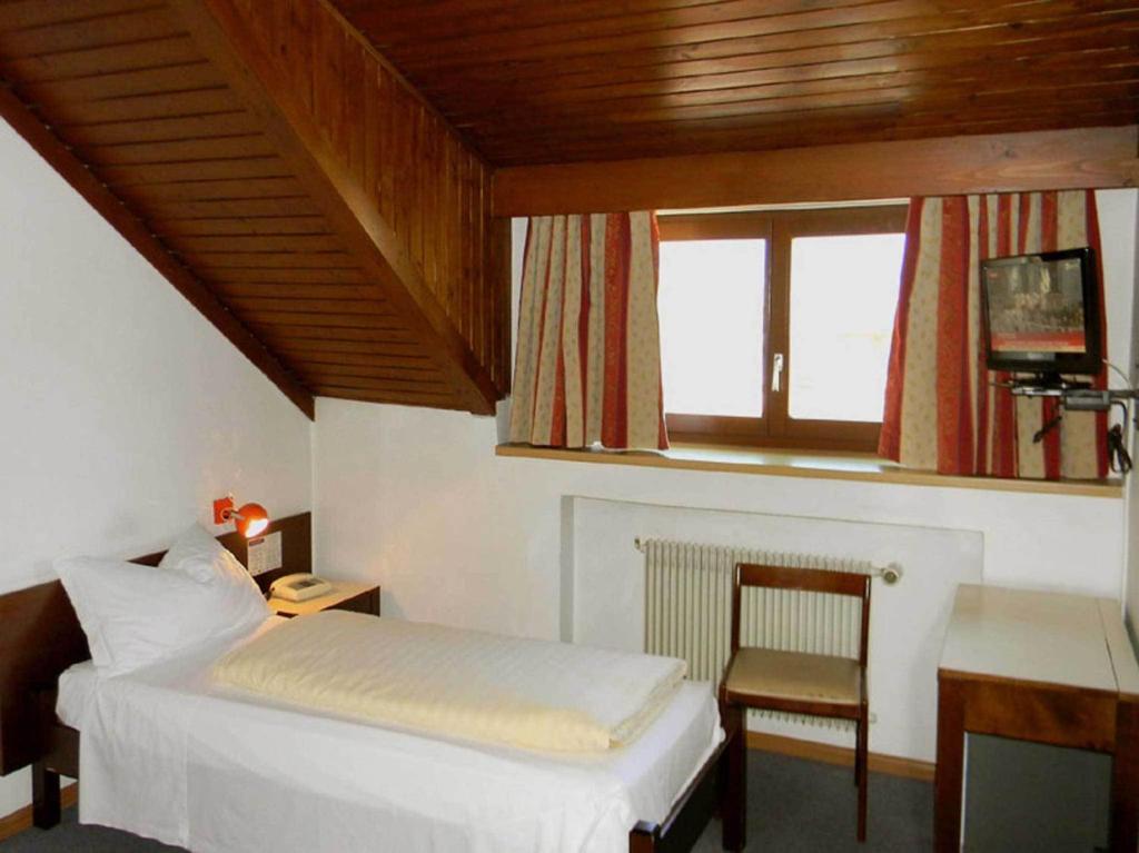Postel nebo postele na pokoji v ubytování Hotel Bologna