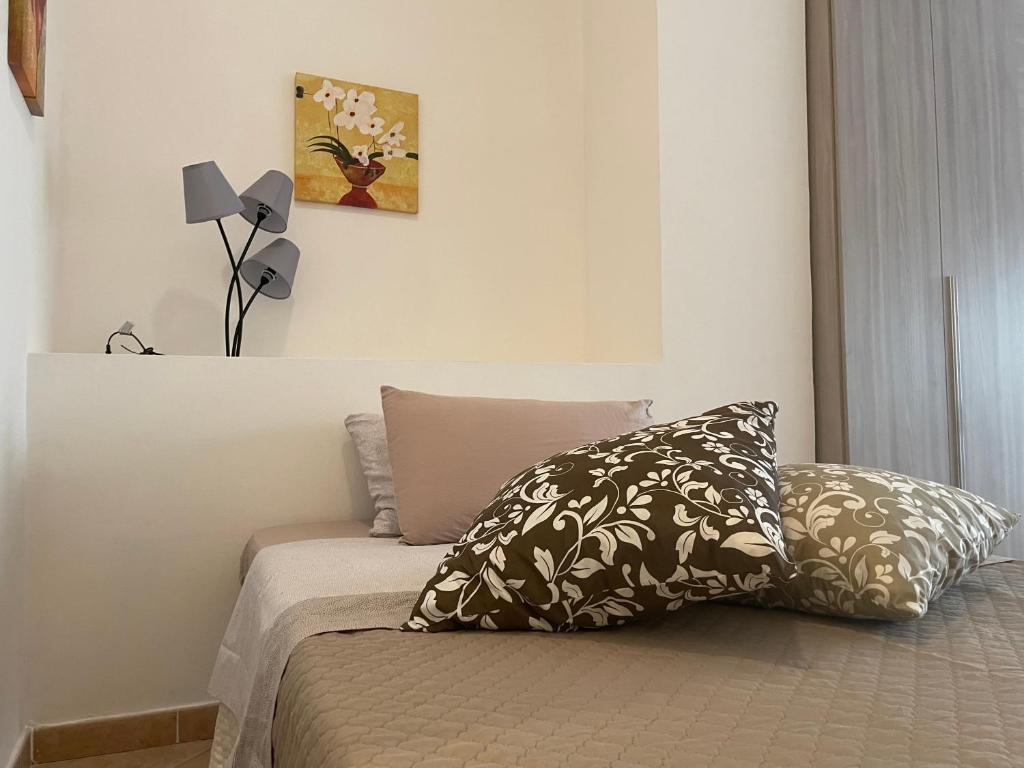 Łóżko lub łóżka w pokoju w obiekcie Viale Umberto I Apartments