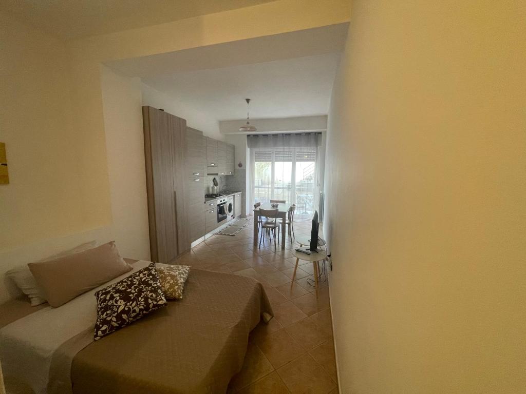 Łóżko lub łóżka w pokoju w obiekcie Viale Umberto I Apartments