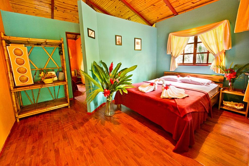 Postel nebo postele na pokoji v ubytování Hotel La Diosa