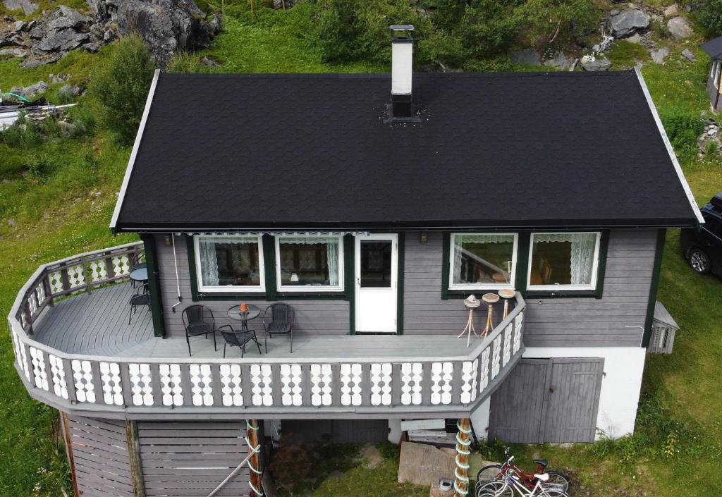 an aerial view of a house with a deck at Rivdnji Holiday Home Smørfjord in Russenes