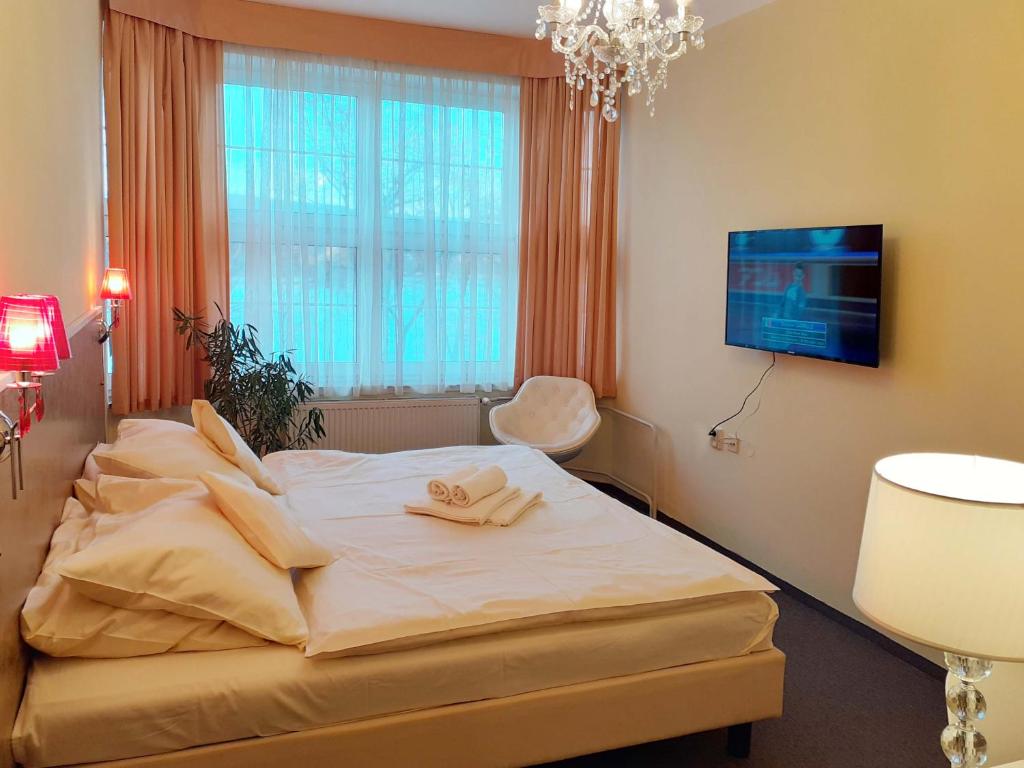 Postel nebo postele na pokoji v ubytování Hotel Casanova