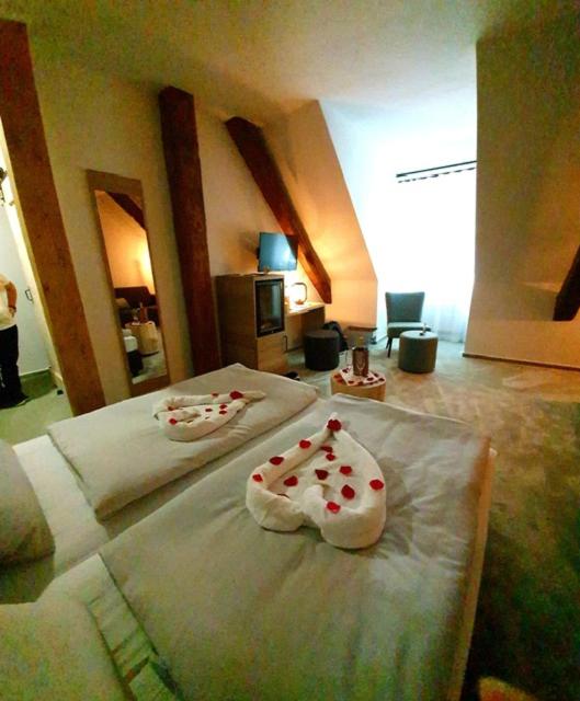 Postel nebo postele na pokoji v ubytování Hotel Le Filou
