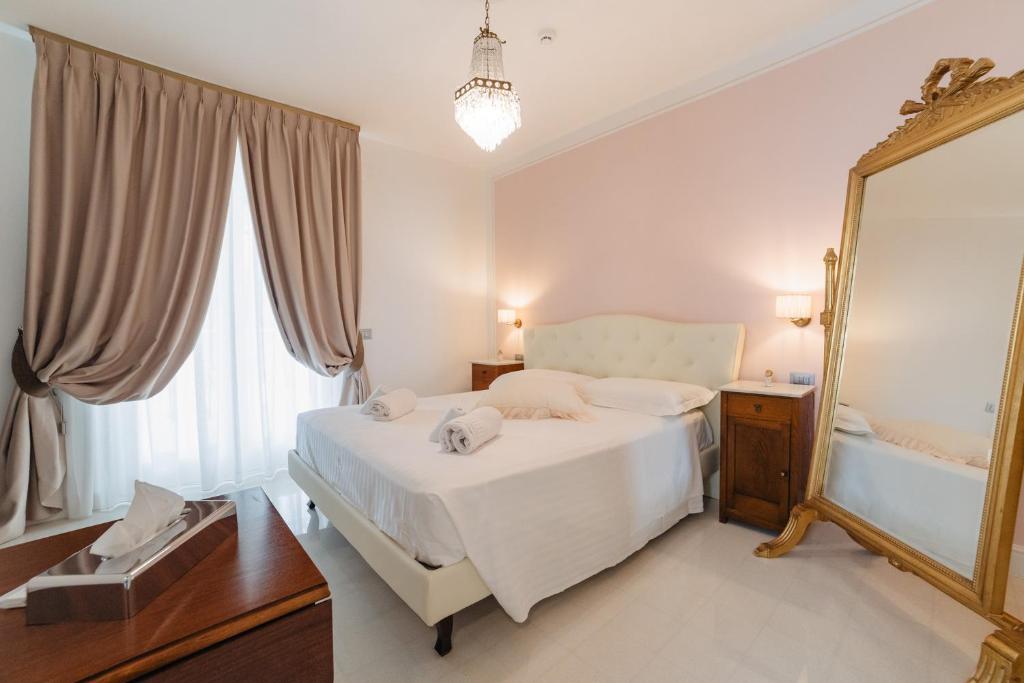 Postel nebo postele na pokoji v ubytování Villa Eleonora Paestum