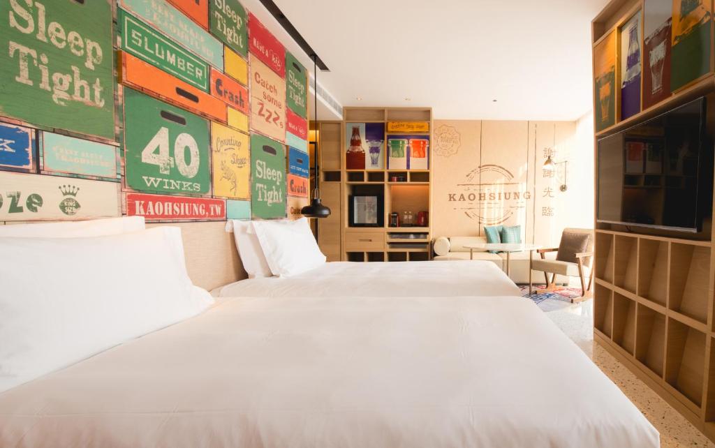 Postel nebo postele na pokoji v ubytování Hotel Indigo Kaohsiung Central Park by IHG