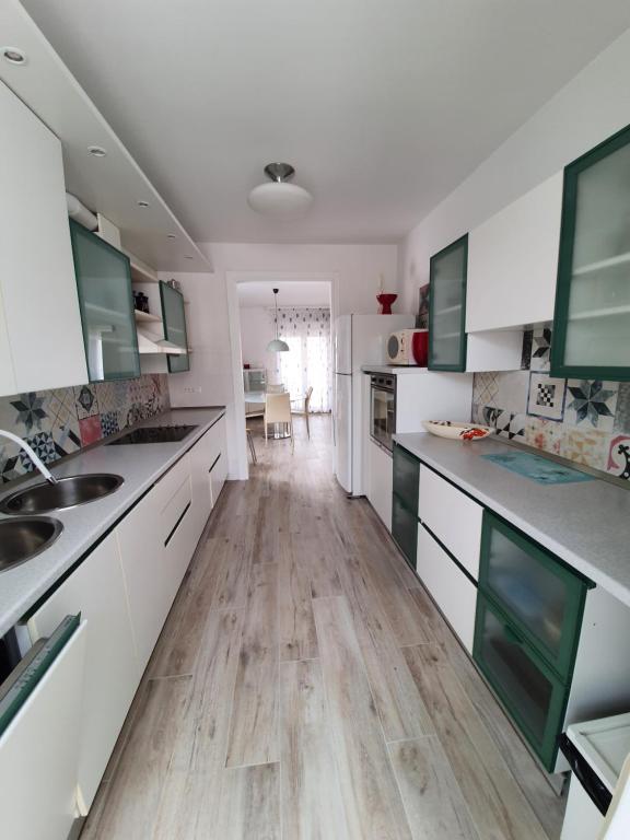 Kuchyň nebo kuchyňský kout v ubytování Apartment Tina