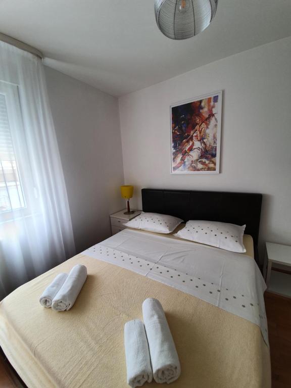 Postel nebo postele na pokoji v ubytování Apartment Tina