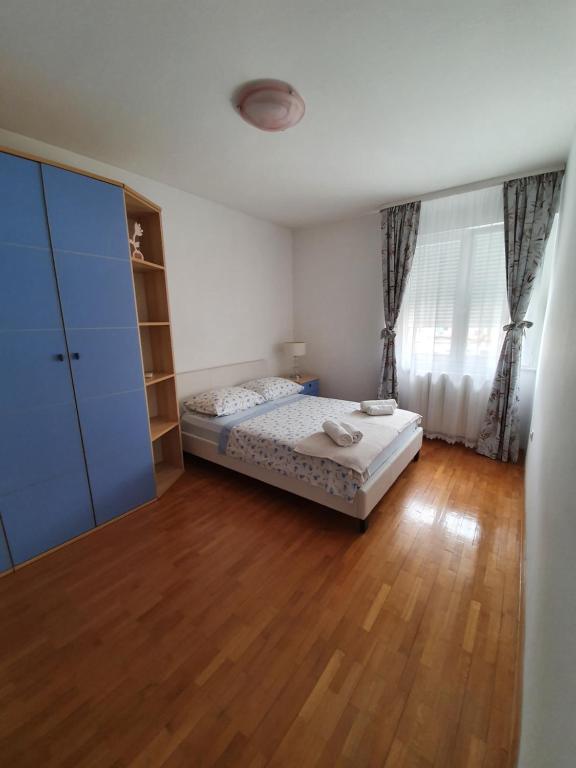 Postel nebo postele na pokoji v ubytování Apartment Tina