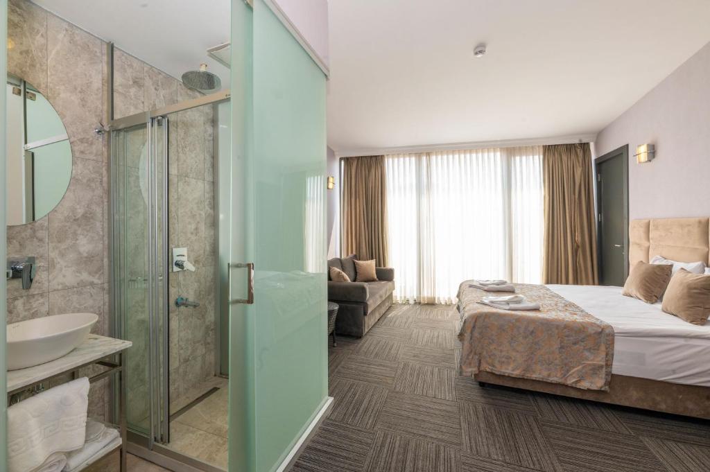 A bed or beds in a room at Taksim Hotel V Plus