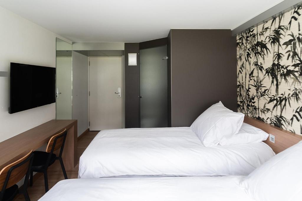 Postel nebo postele na pokoji v ubytování Hotel de Werelt