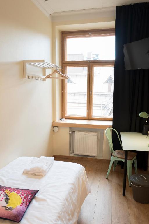 Postel nebo postele na pokoji v ubytování Hotel Finn