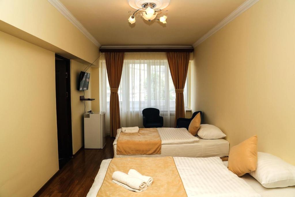 Postel nebo postele na pokoji v ubytování Goris Hotel
