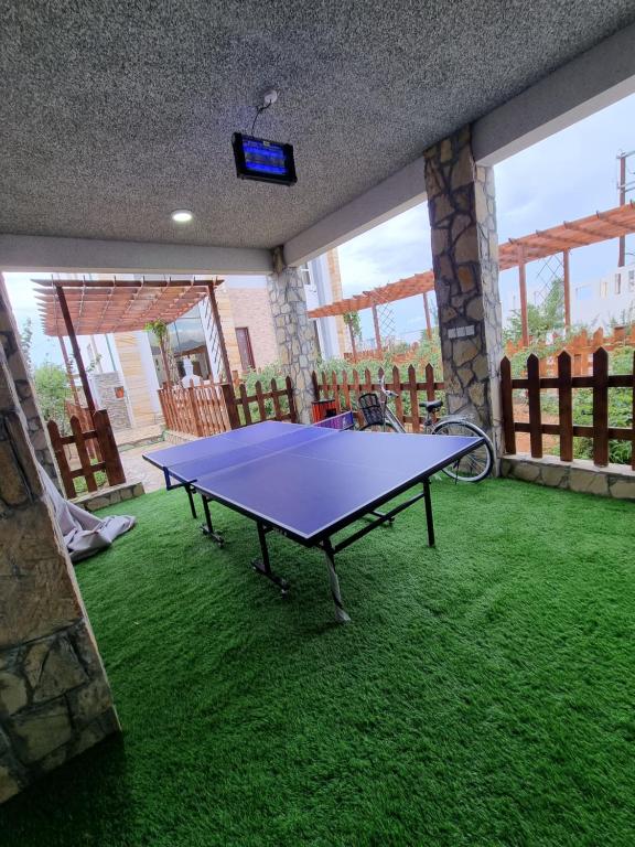 Stolní tenis v ubytování فيلا الغروب الجبل الأخضر nebo okolí