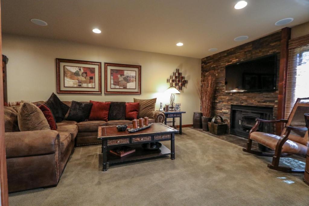 a living room with a couch and a fireplace at Snowcreek 269 Condo in Mammoth Lakes