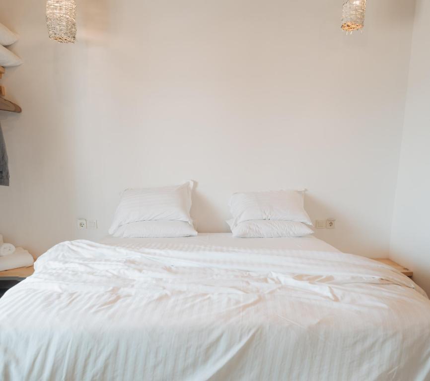 Postel nebo postele na pokoji v ubytování Votsalo Cozy Apartments