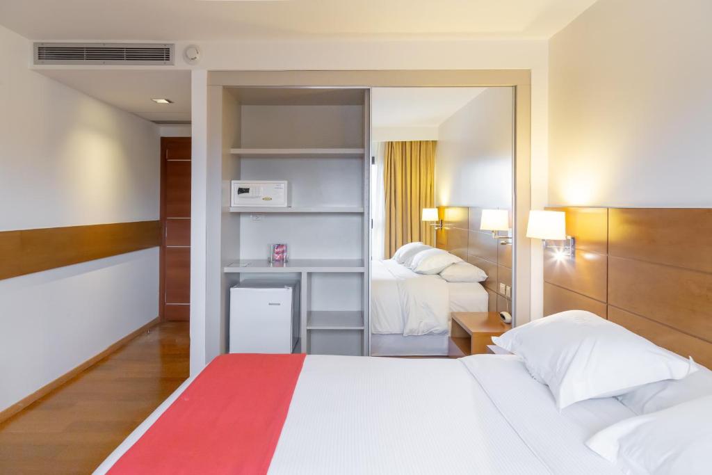 Postel nebo postele na pokoji v ubytování Neper Hotel