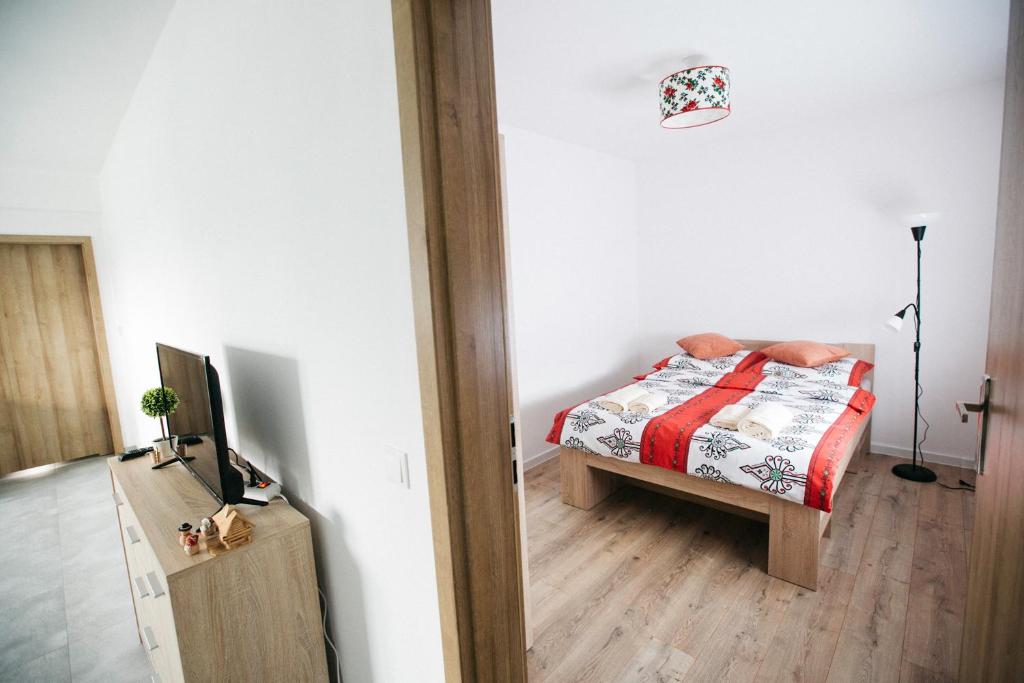 Posteľ alebo postele v izbe v ubytovaní Apartamenty Perła Orawy