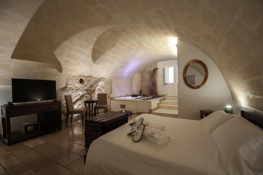 Una cama o camas en una habitación de Le Origini