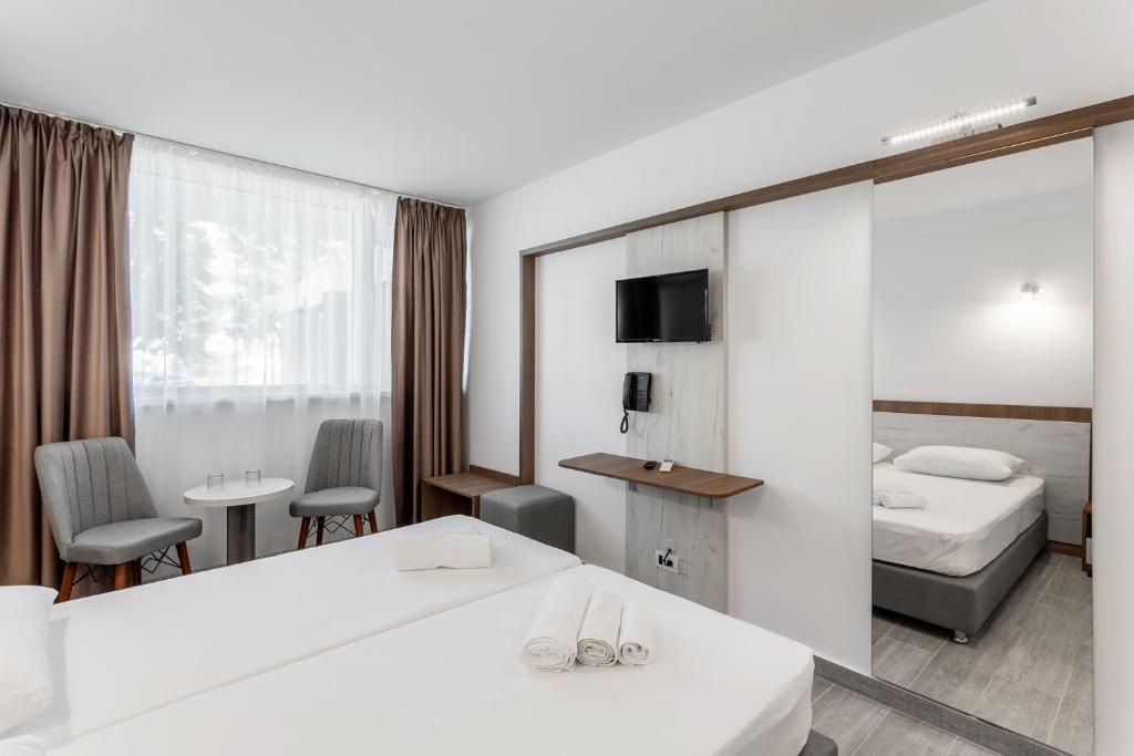 Postel nebo postele na pokoji v ubytování Hotel Neko