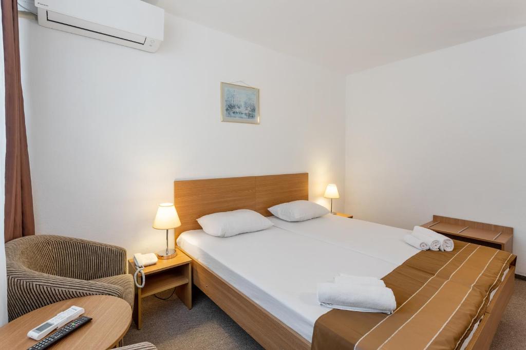 Postel nebo postele na pokoji v ubytování Hotel Neko