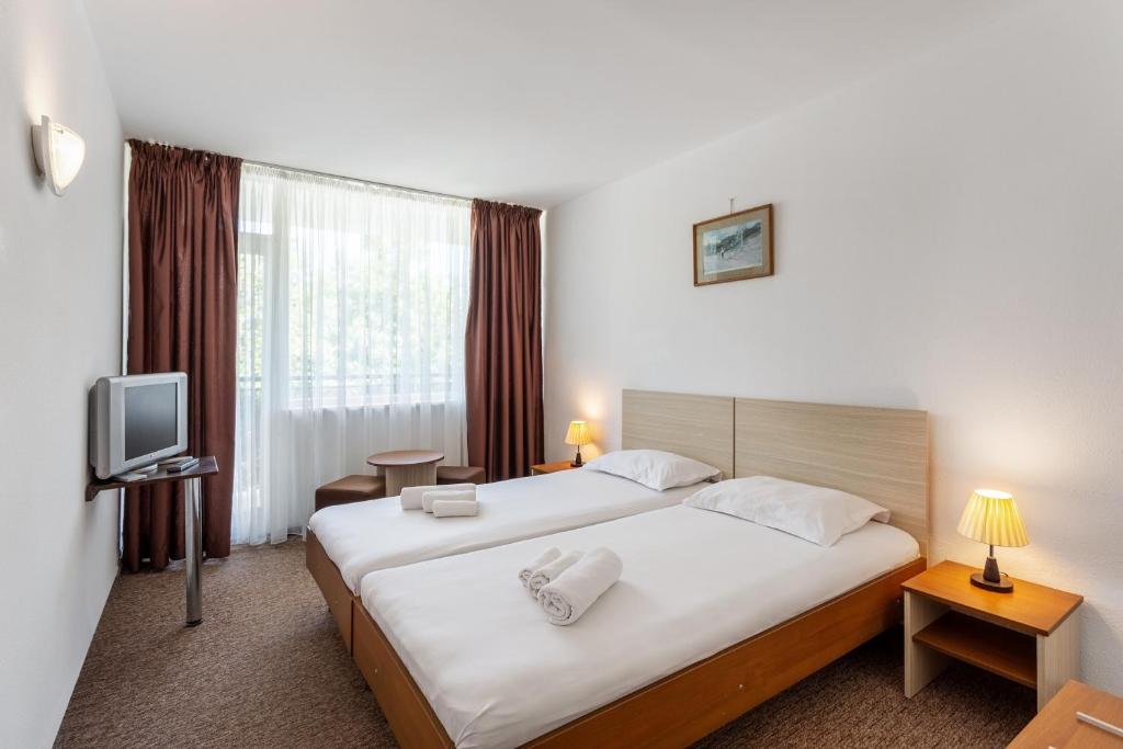 Postel nebo postele na pokoji v ubytování Hotel Neko
