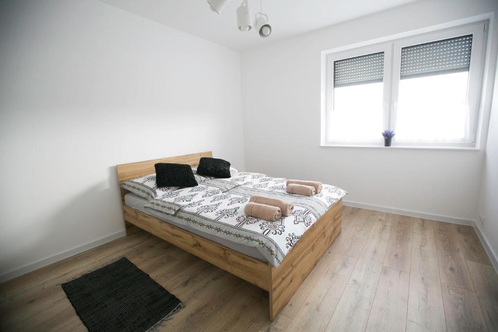Posteľ alebo postele v izbe v ubytovaní Apartamenty Perła Orawy