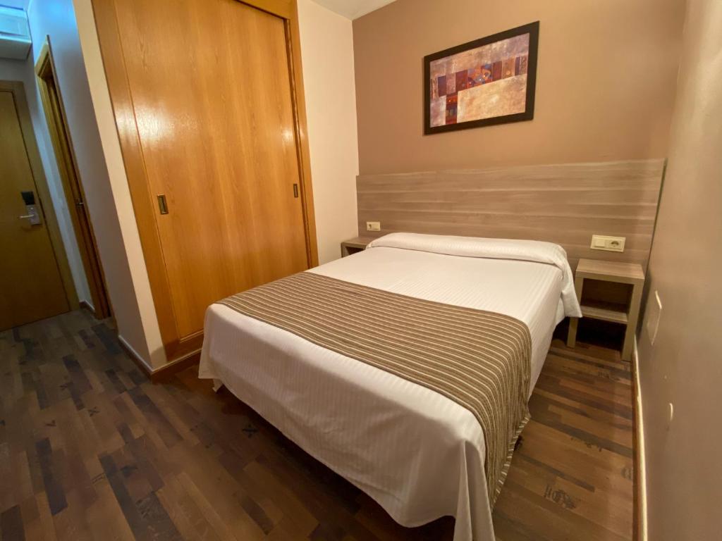 Postel nebo postele na pokoji v ubytování Somriu Hotel Vall Ski