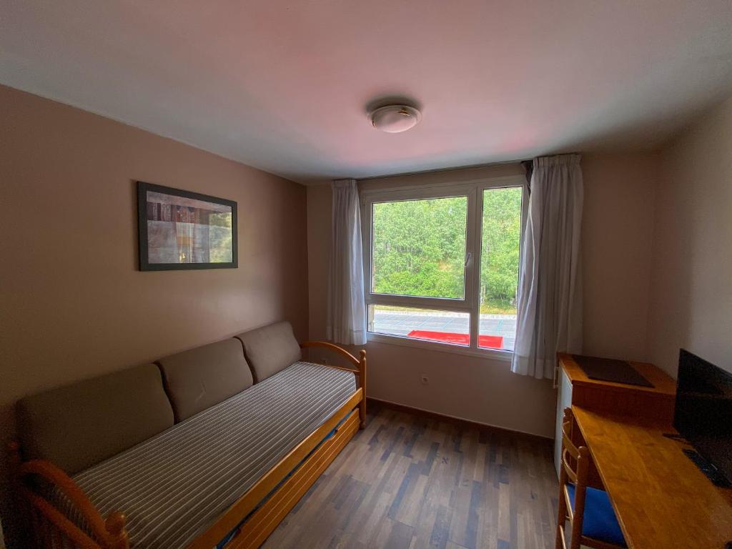 TV a/nebo společenská místnost v ubytování Somriu Hotel Vall Ski