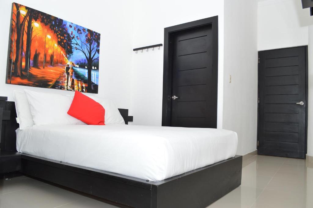Postel nebo postele na pokoji v ubytování Hotel Merey