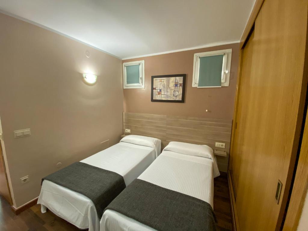 Postel nebo postele na pokoji v ubytování Somriu Hotel Vall Ski