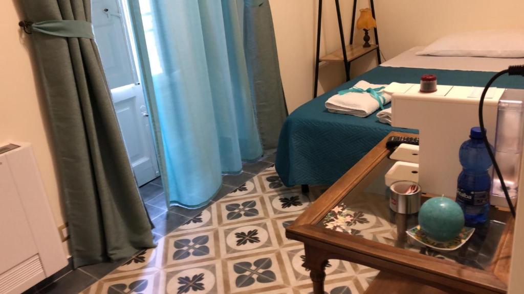 Łóżko lub łóżka w pokoju w obiekcie Domus Aurea