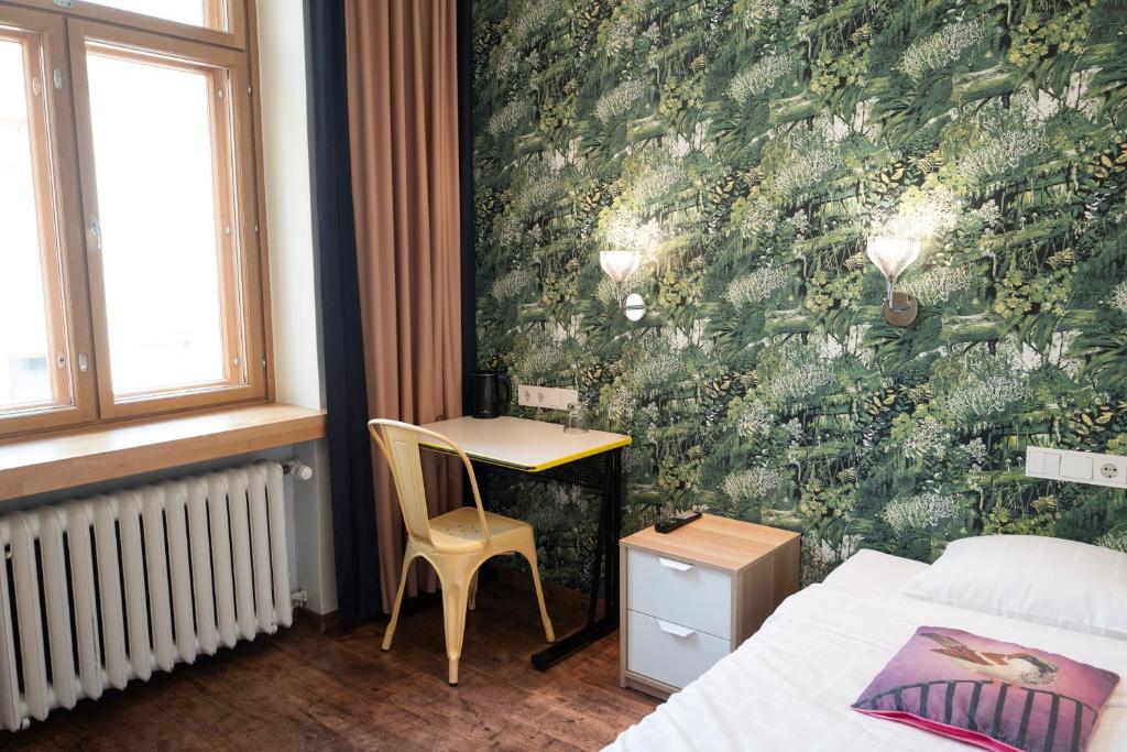 Postel nebo postele na pokoji v ubytování Hotel Finn