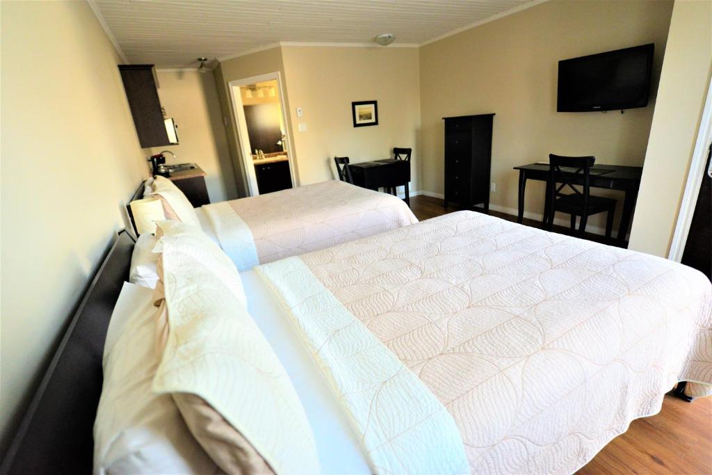 Postel nebo postele na pokoji v ubytování Motel L'Abri