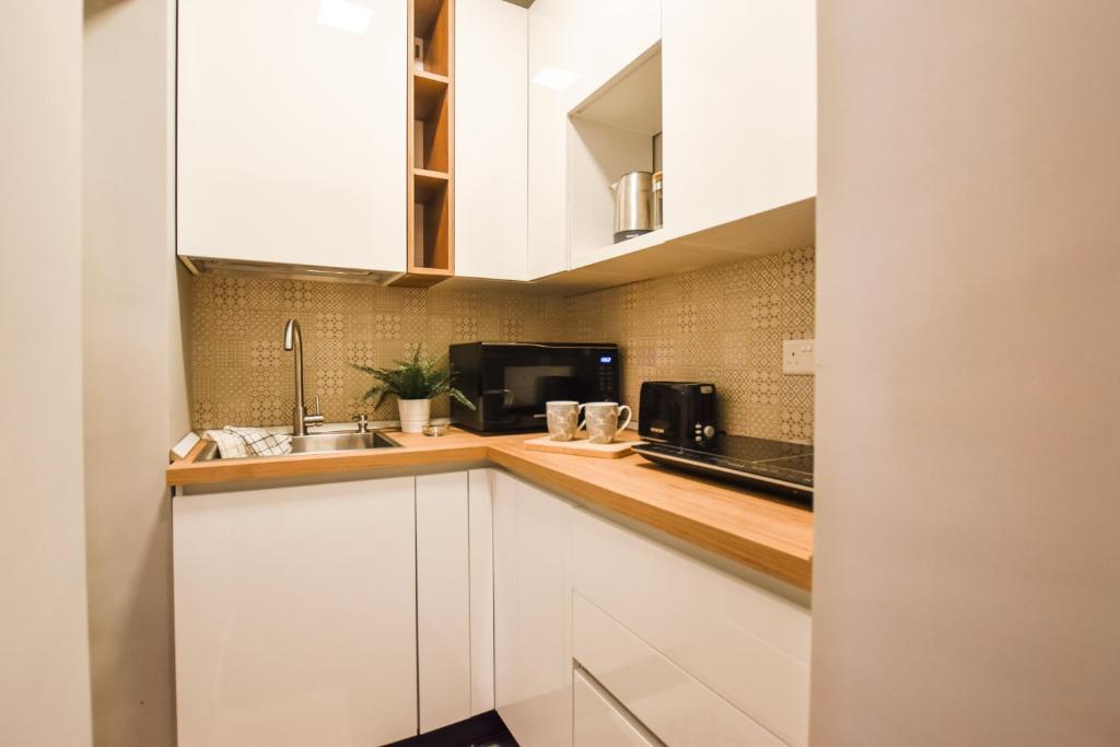 Kuchyň nebo kuchyňský kout v ubytování Cosy Albert's Seaside Suites (Sliema)