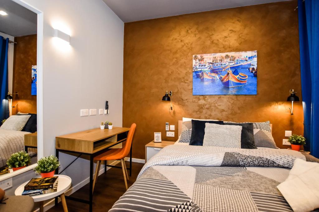 Postel nebo postele na pokoji v ubytování Cosy Albert's Seaside Suites (Sliema)