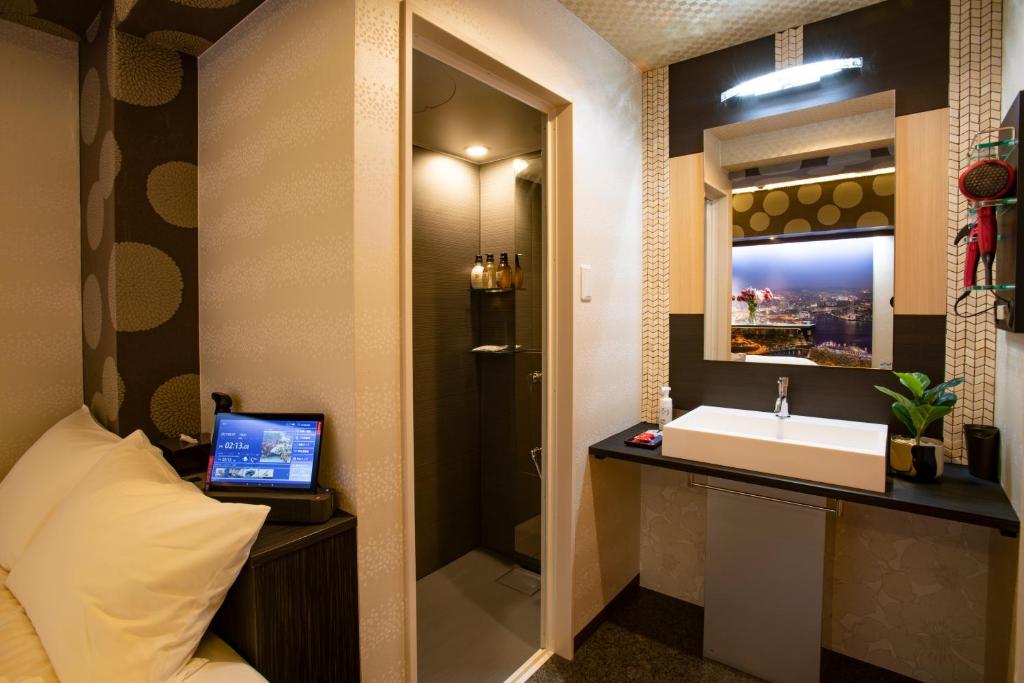TV a/nebo společenská místnost v ubytování Hotel Xcell Hiroshima Nagarekawa