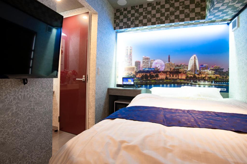 Postel nebo postele na pokoji v ubytování Hotel Xcell Hiroshima Nagarekawa