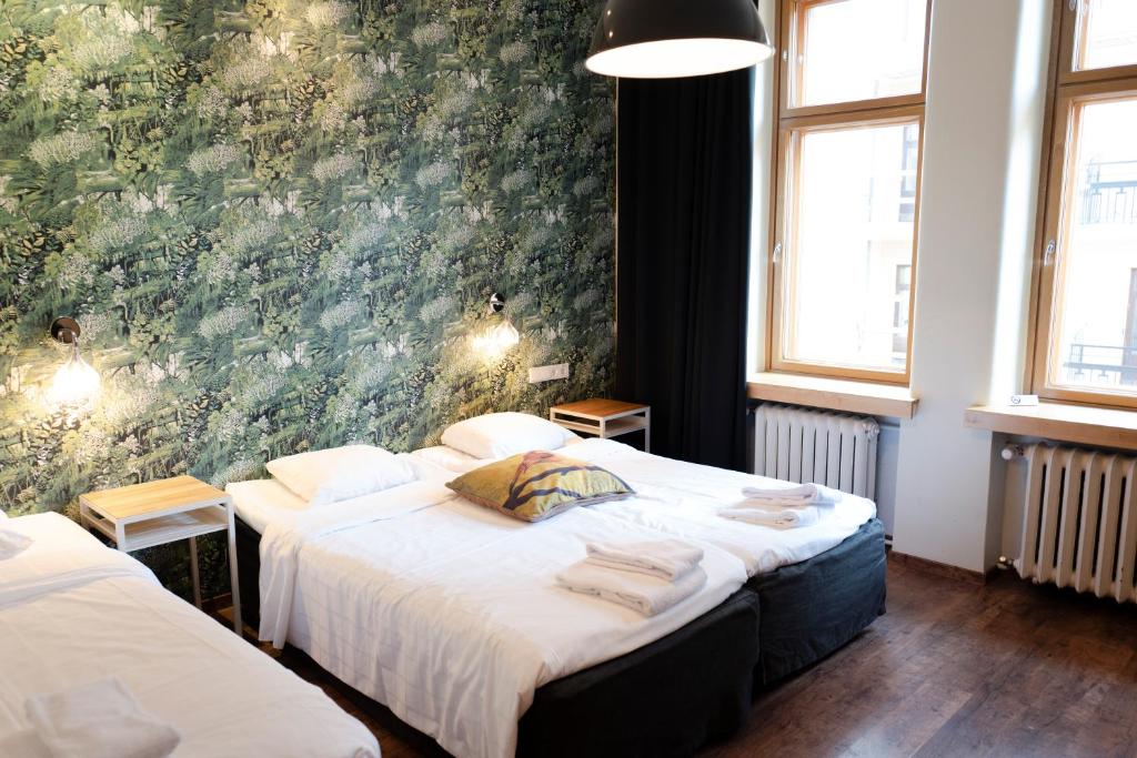 Postel nebo postele na pokoji v ubytování Hotel Finn