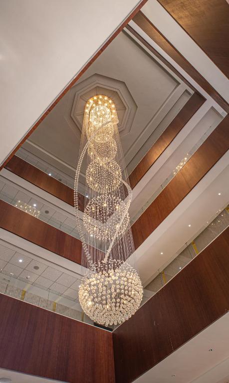 a chandelier hanging from the ceiling in a building at Waves Aqua Resort in Kenitra