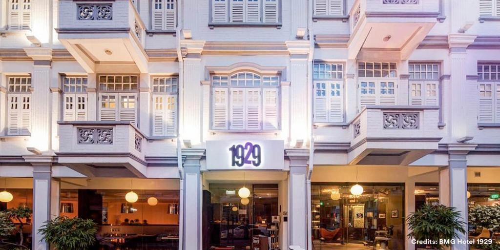 a building with a clock on the front of it at Hotel 1929 in Singapore