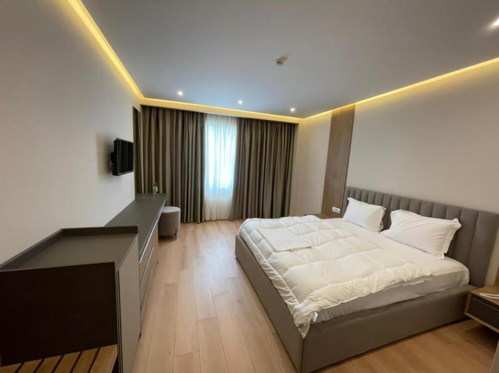 Postel nebo postele na pokoji v ubytování Hotel Colis