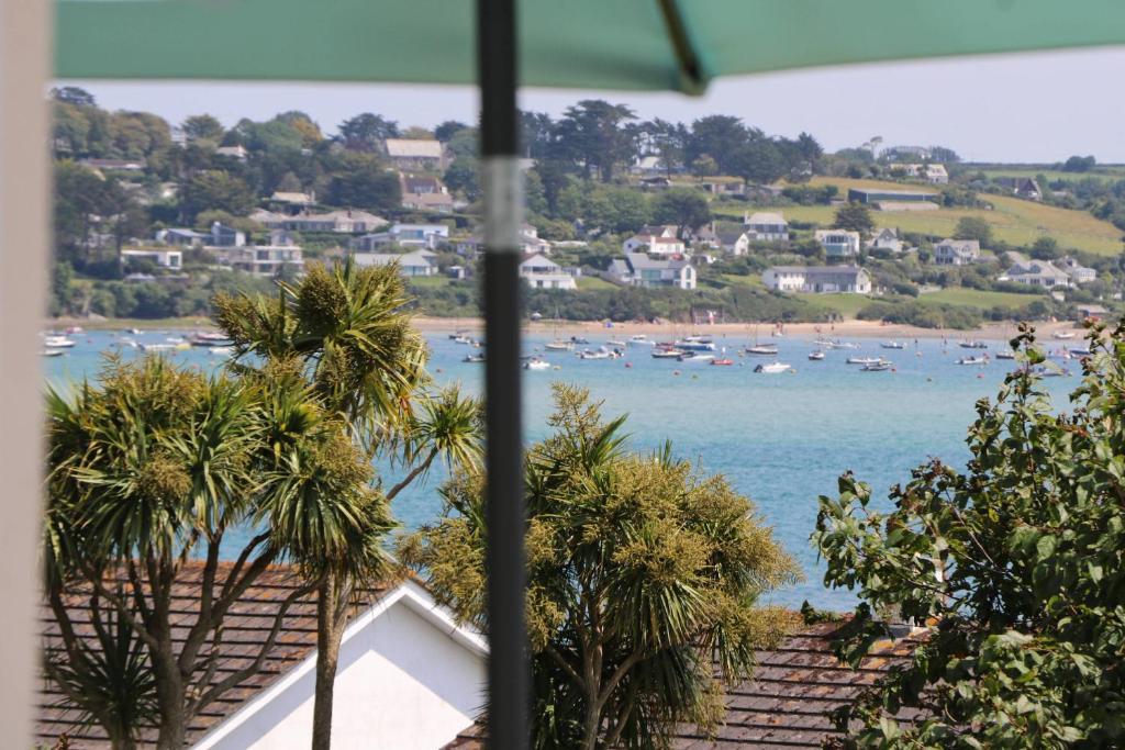 a view of a beach with boats in the water at Holiday home with Estuary Views, parking & balcony in Padstow
