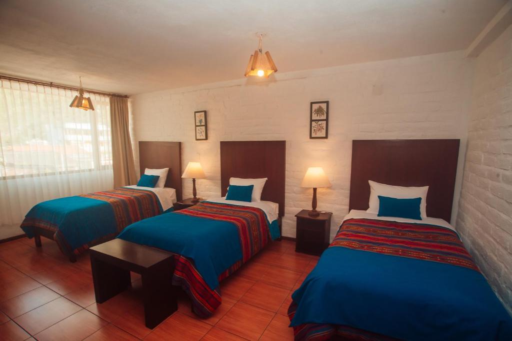 Postel nebo postele na pokoji v ubytování La Floresta Hotel