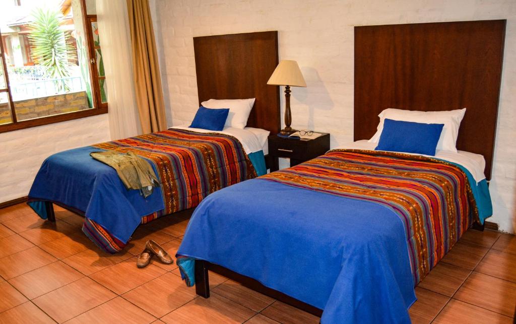 Postel nebo postele na pokoji v ubytování La Floresta Hotel