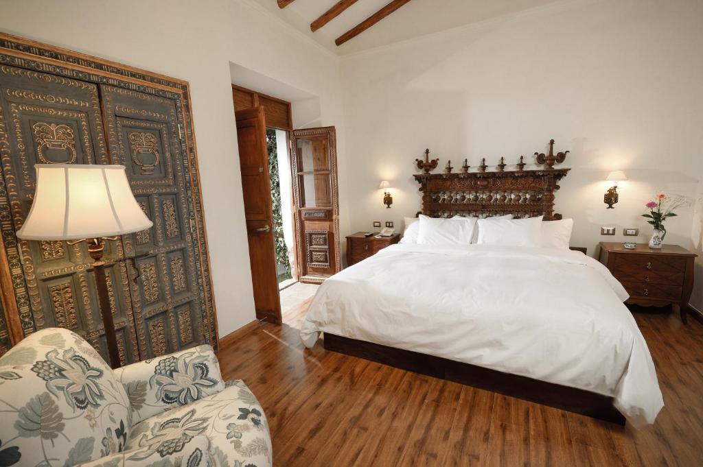 Postel nebo postele na pokoji v ubytování Palacio Manco Capac by Ananay Hotels