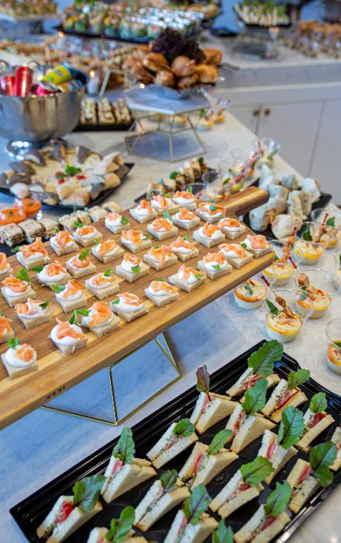 a buffet with many different types of food on a table at Waves Aqua Resort in Kenitra