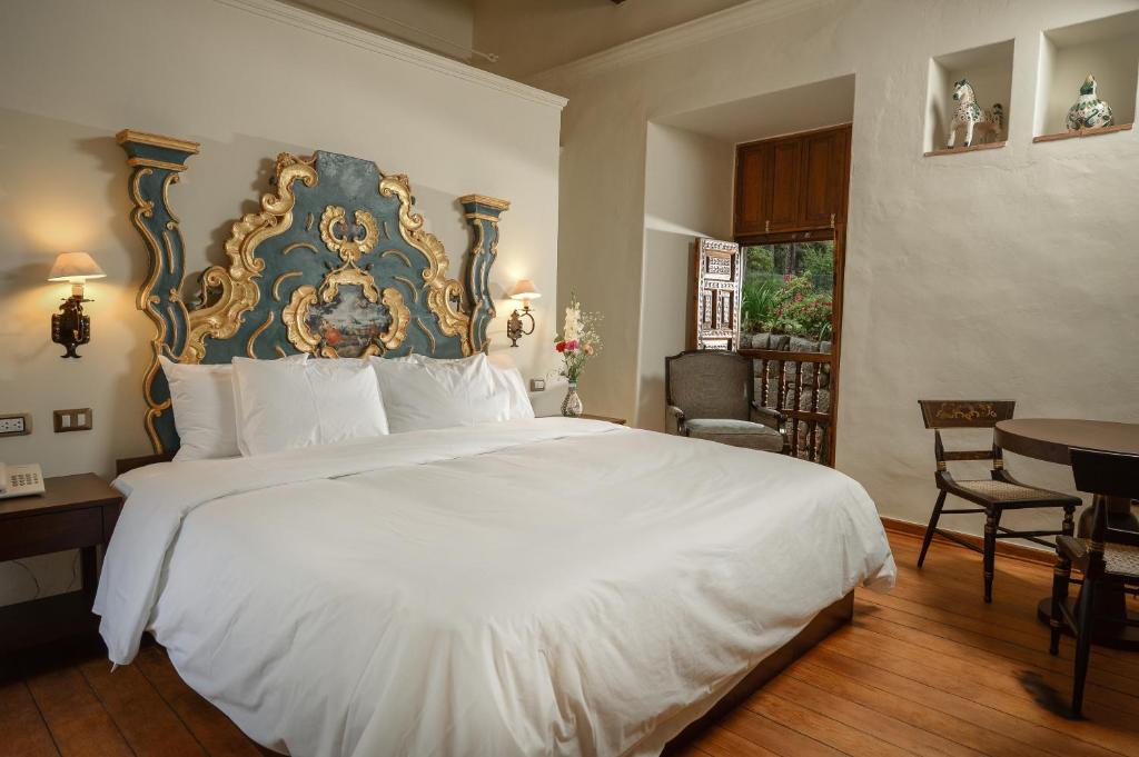 Postel nebo postele na pokoji v ubytování Palacio Manco Capac by Ananay Hotels